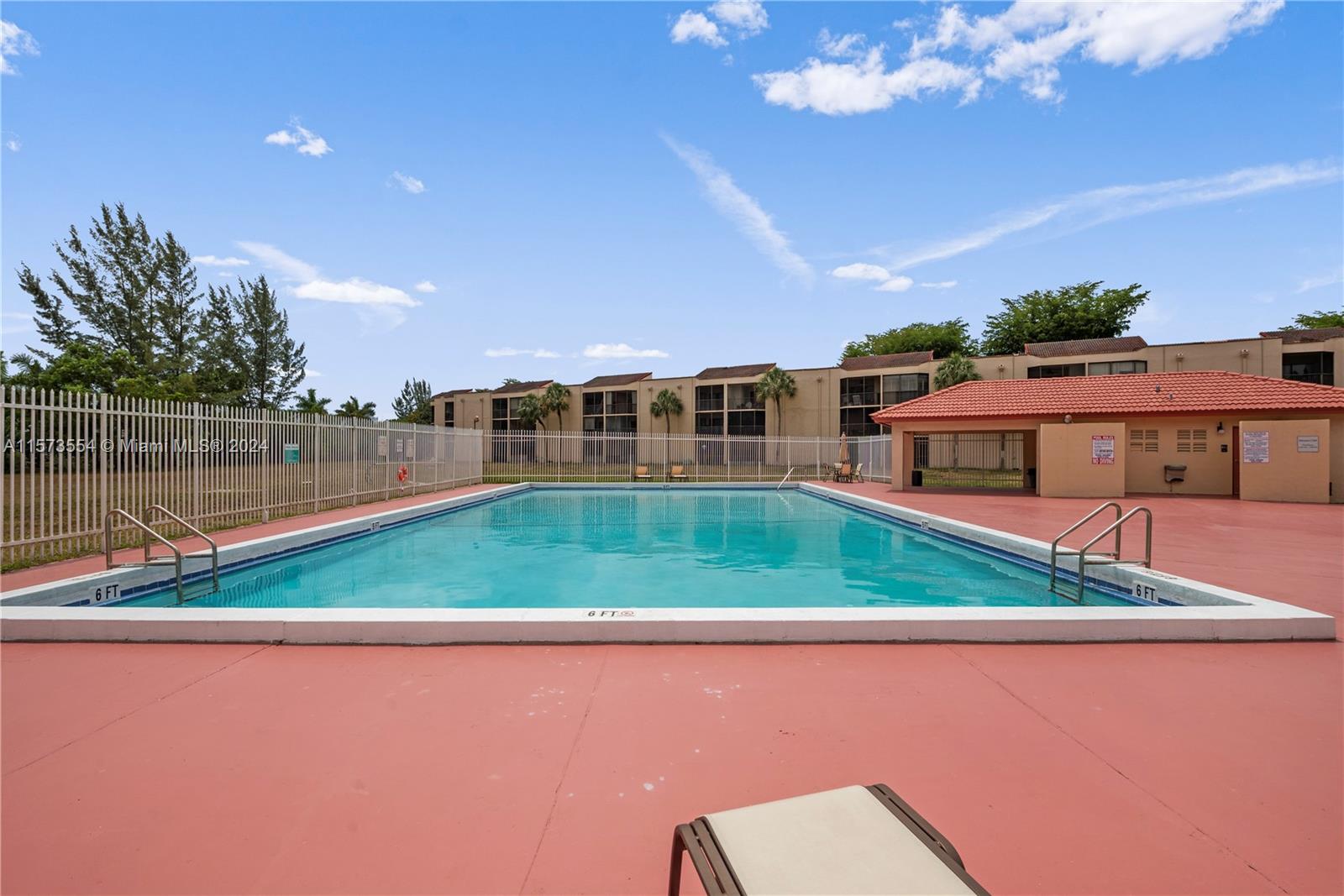 3252 Foxcroft Road, Unit 216 Miramar, FL 33025 - Photo 16 of 16 a view of yard with swimming pool and outdoor seating