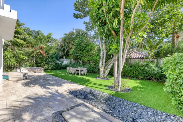 a view of a park with large trees