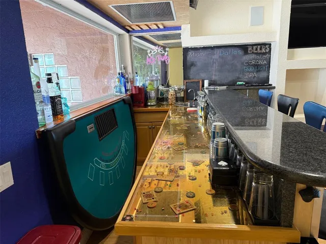 a spacious bedroom with a bed and ceiling fan