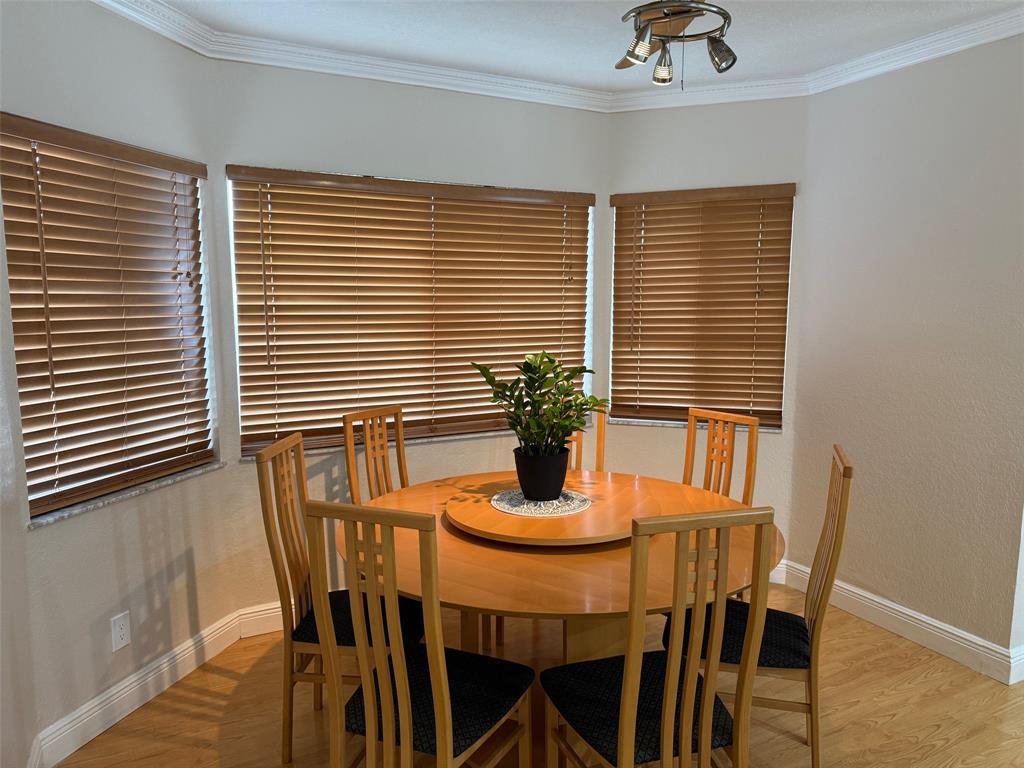 3290 Southwest 131st Terrace Davie, FL 33330 - Photo 20 of 46 a dining room with furniture and wooden floor