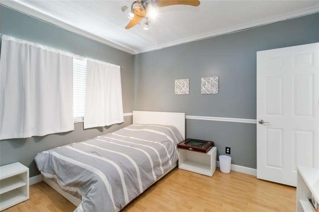 3290 Southwest 131st Terrace Davie, FL 33330 - Photo 32 of 46 a bedroom with a bed and a window