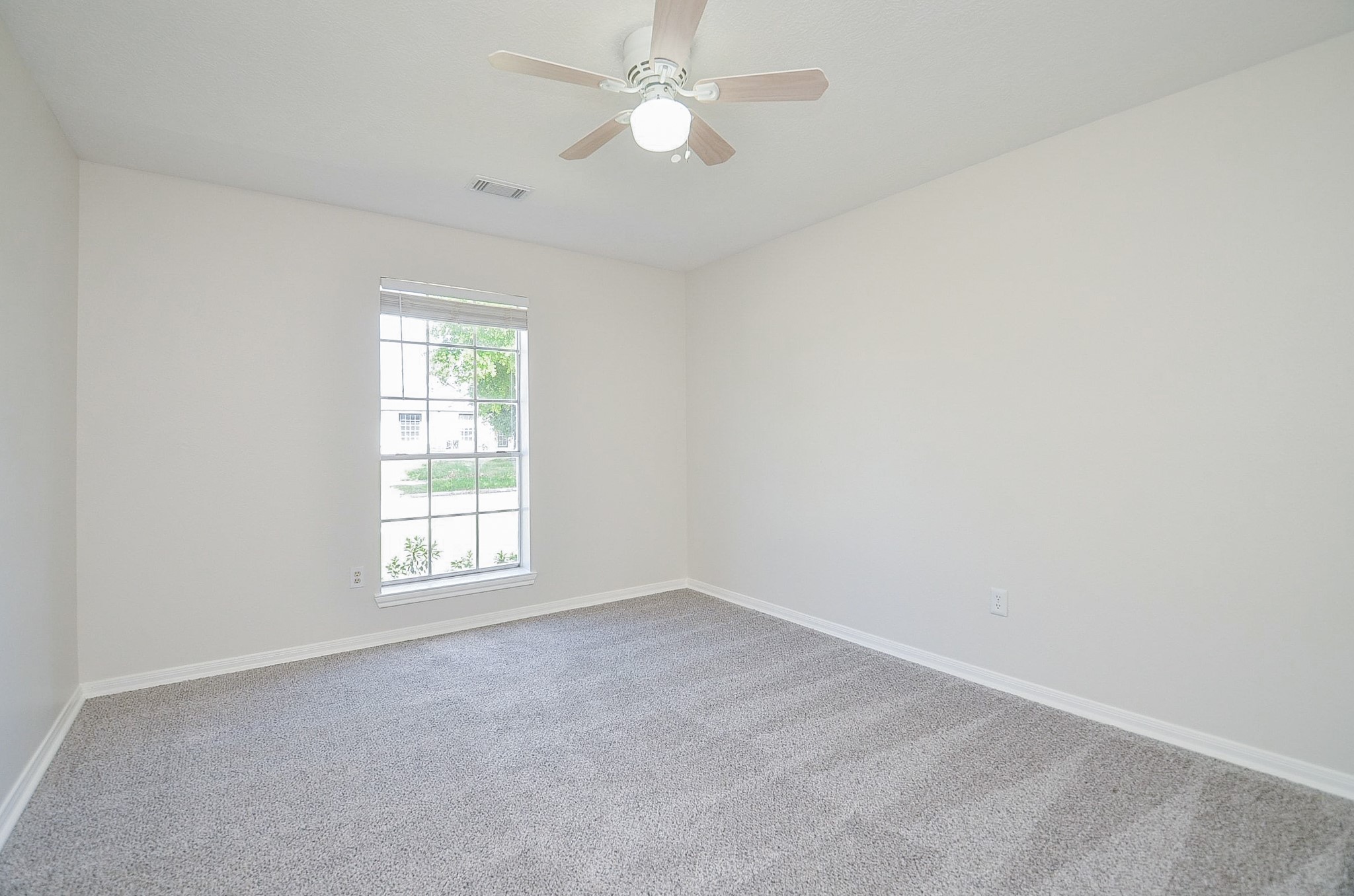 22819 Pebworth Place Spring, TX 77373 - Photo 16 of 22 Secondary bedroom with ceiling fan, new carpet and walk-in closet.