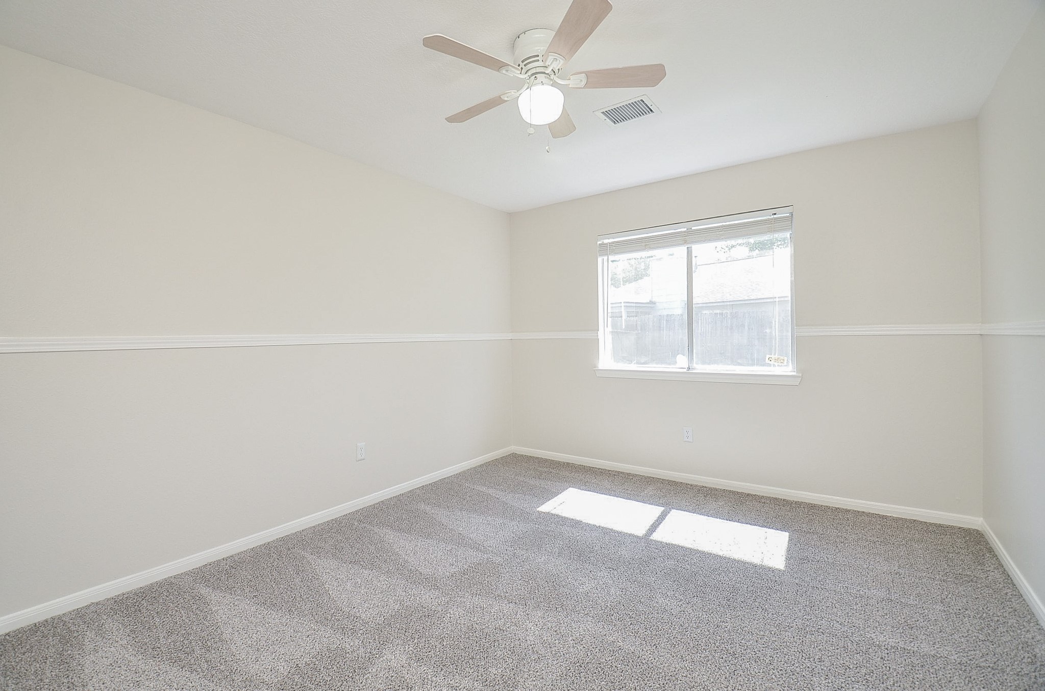 22819 Pebworth Place Spring, TX 77373 - Photo 17 of 22 Secondary bedroom with ceiling fan, new carpet and walk-in closet.