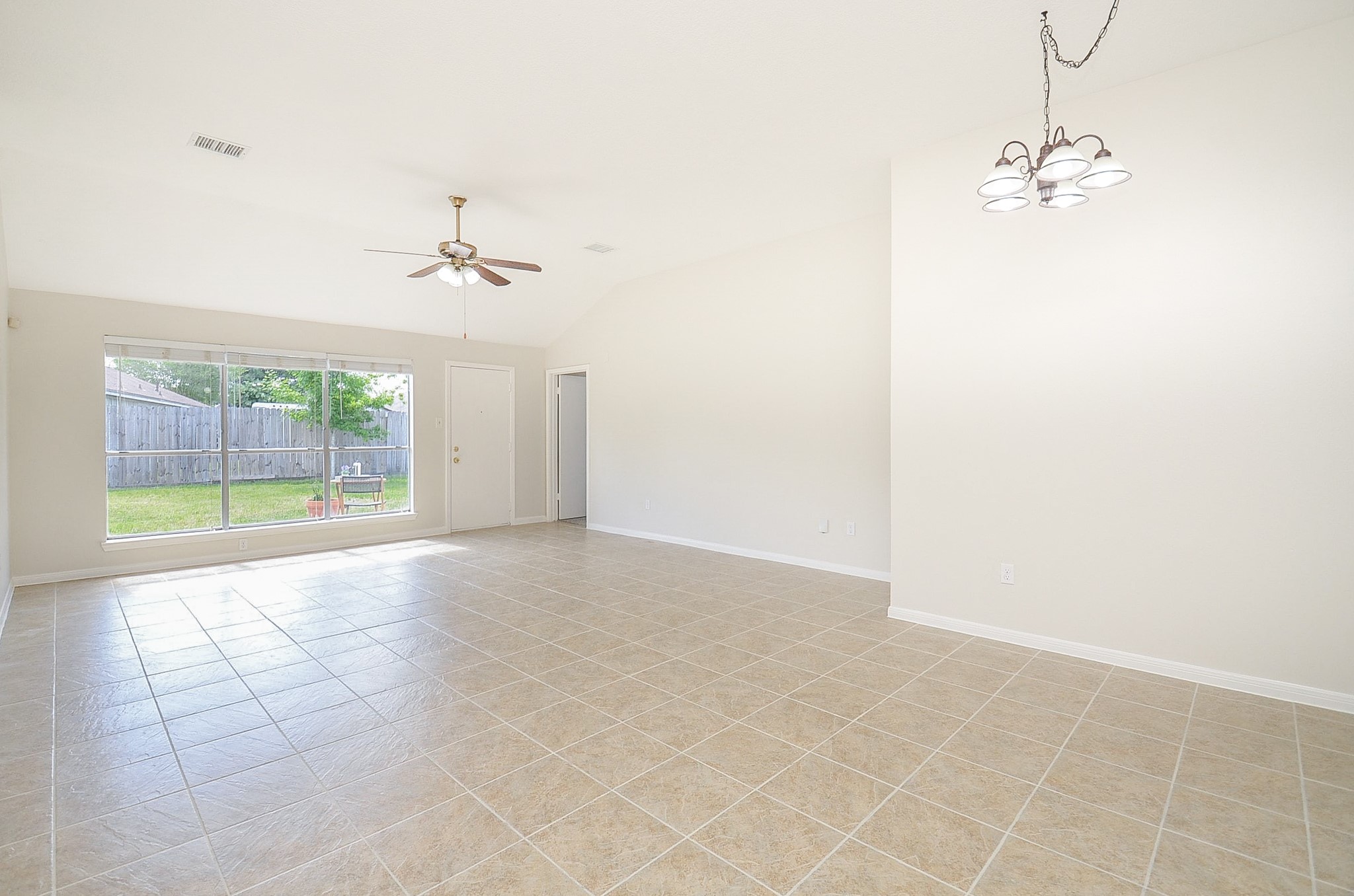 22819 Pebworth Place Spring, TX 77373 - Photo 4 of 22 Large living area, open to kitchen and dining room. High ceilings and upsized windows allow natural light to stream into the home.