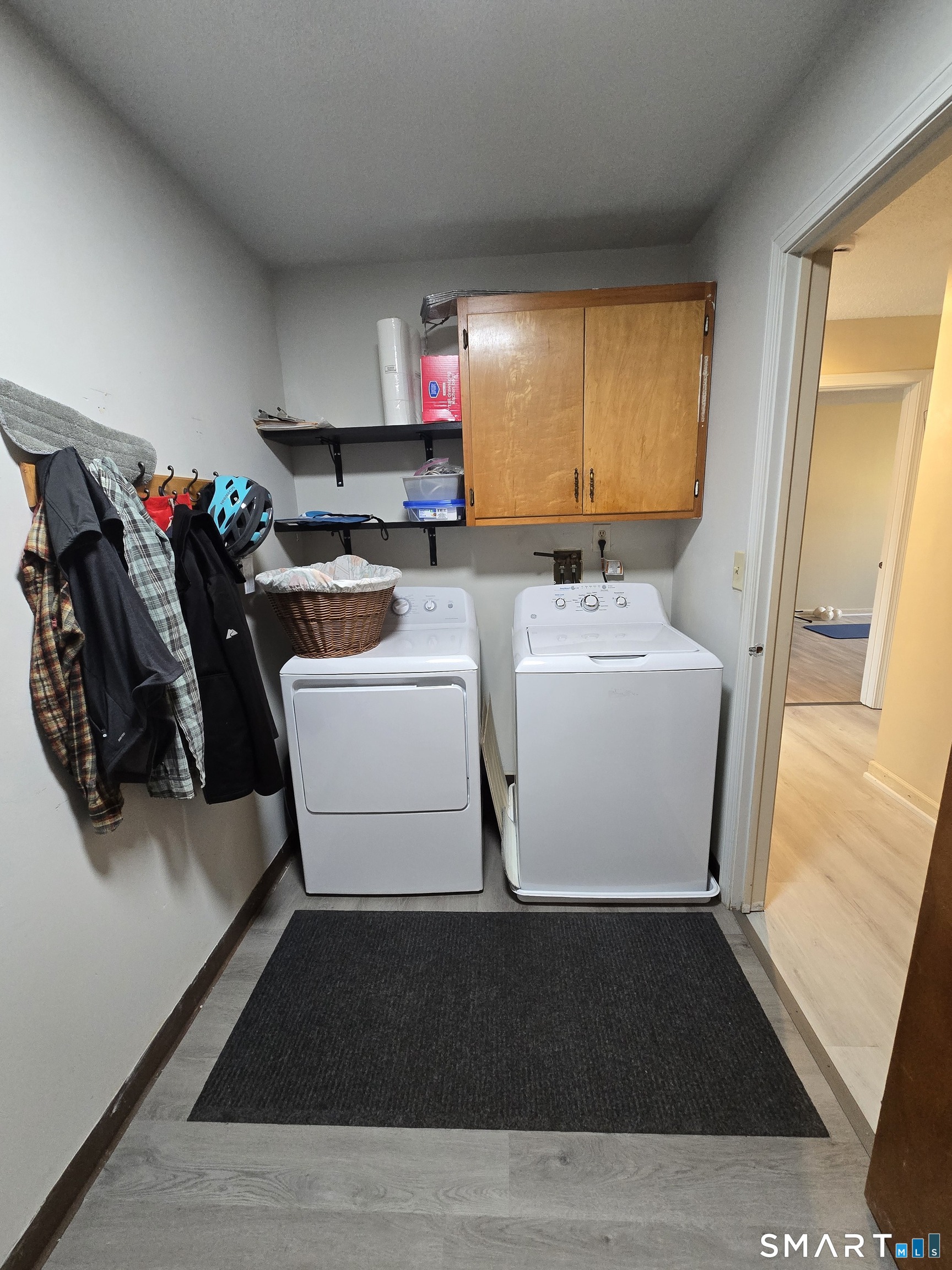 177 Lisle Street, Unit 5 Torrington, CT 06790 - Photo 13 of 18 a utility room with cabinets washer and dryer