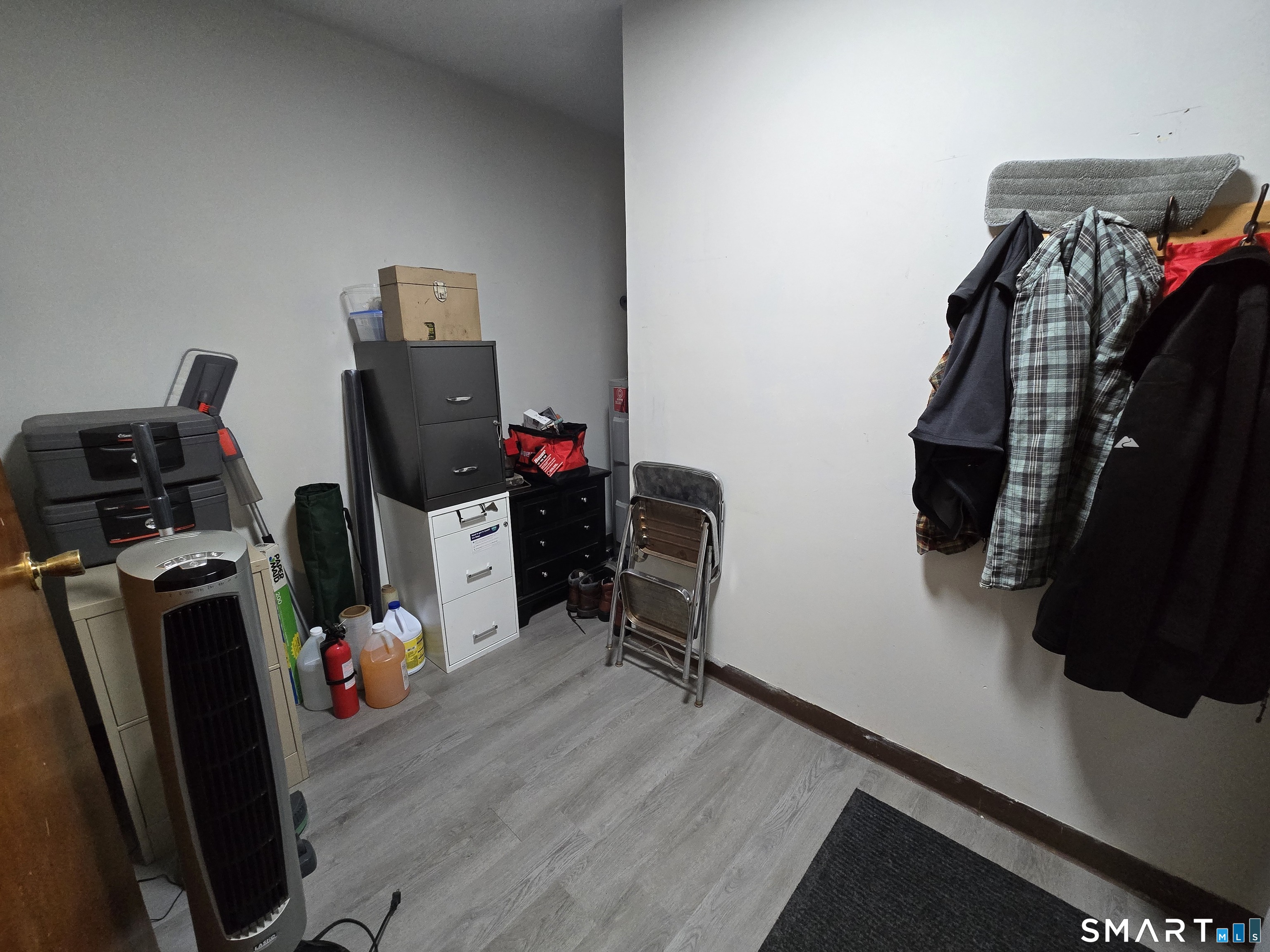 177 Lisle Street, Unit 5 Torrington, CT 06790 - Photo 14 of 18 a view of walk in closet with clothes and shoes