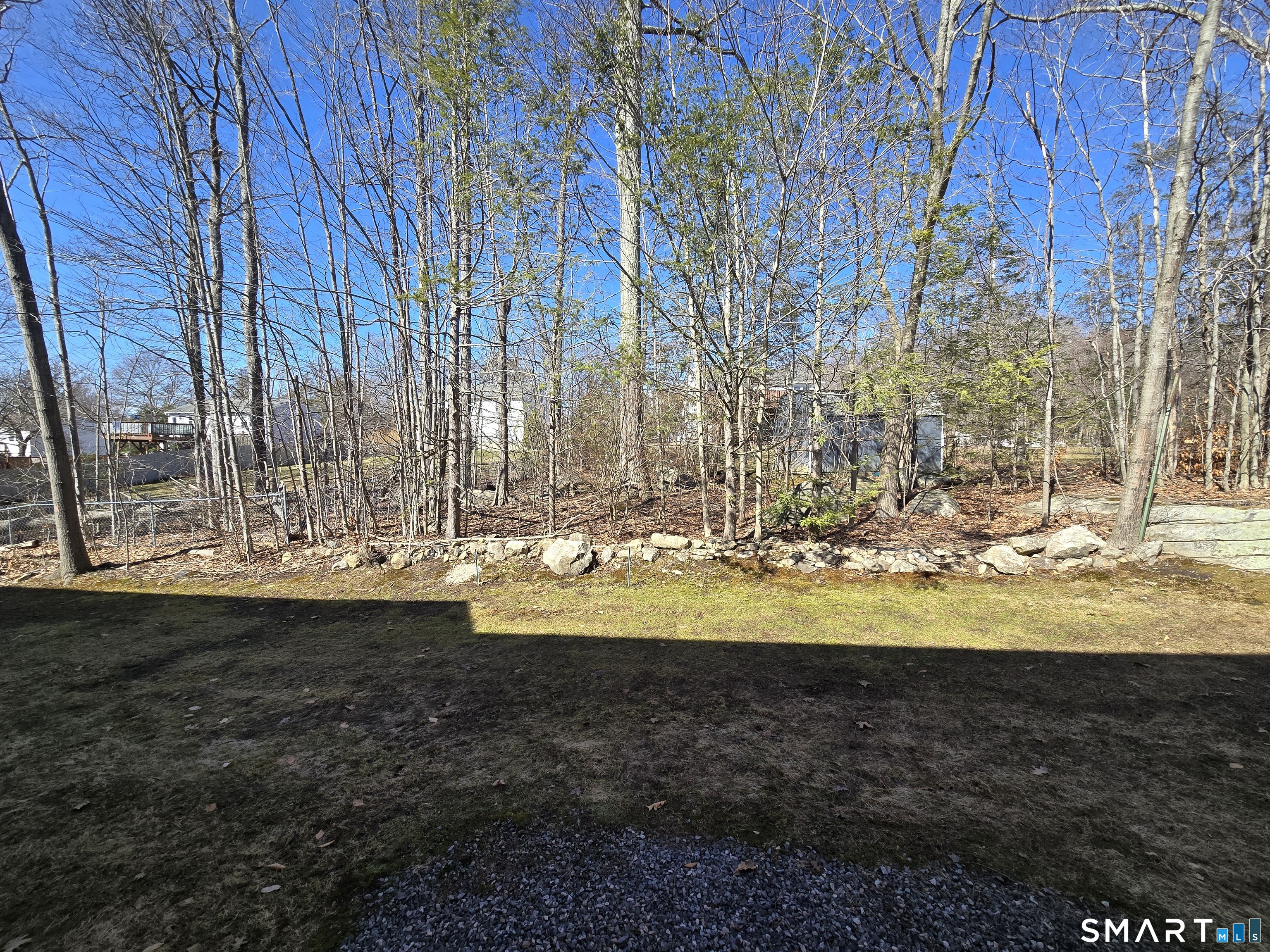 177 Lisle Street, Unit 5 Torrington, CT 06790 - Photo 15 of 18 a view of a yard with wooden fence