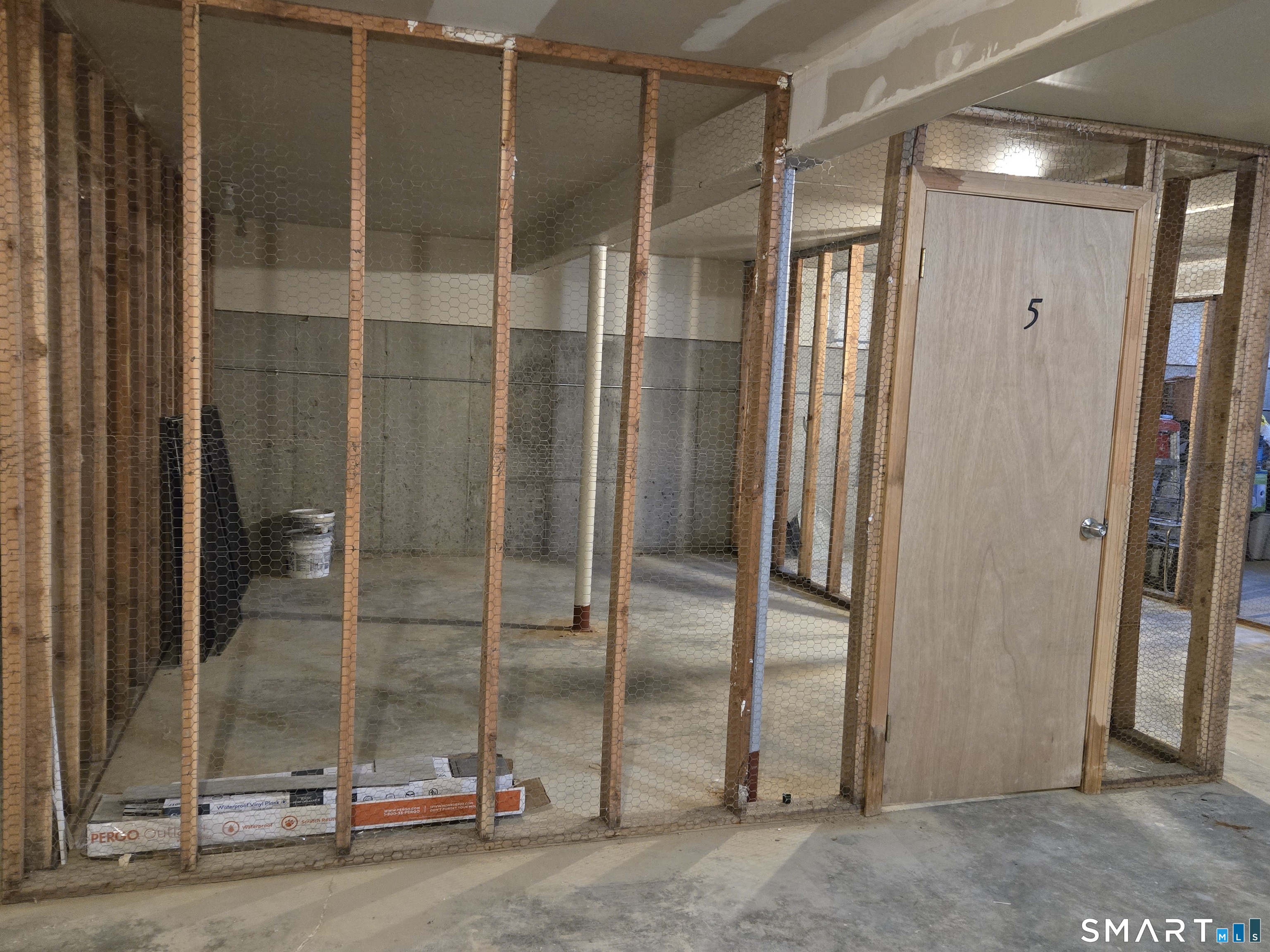 177 Lisle Street, Unit 5 Torrington, CT 06790 - Photo 17 of 18 a view of a bathroom with a glass door and shower