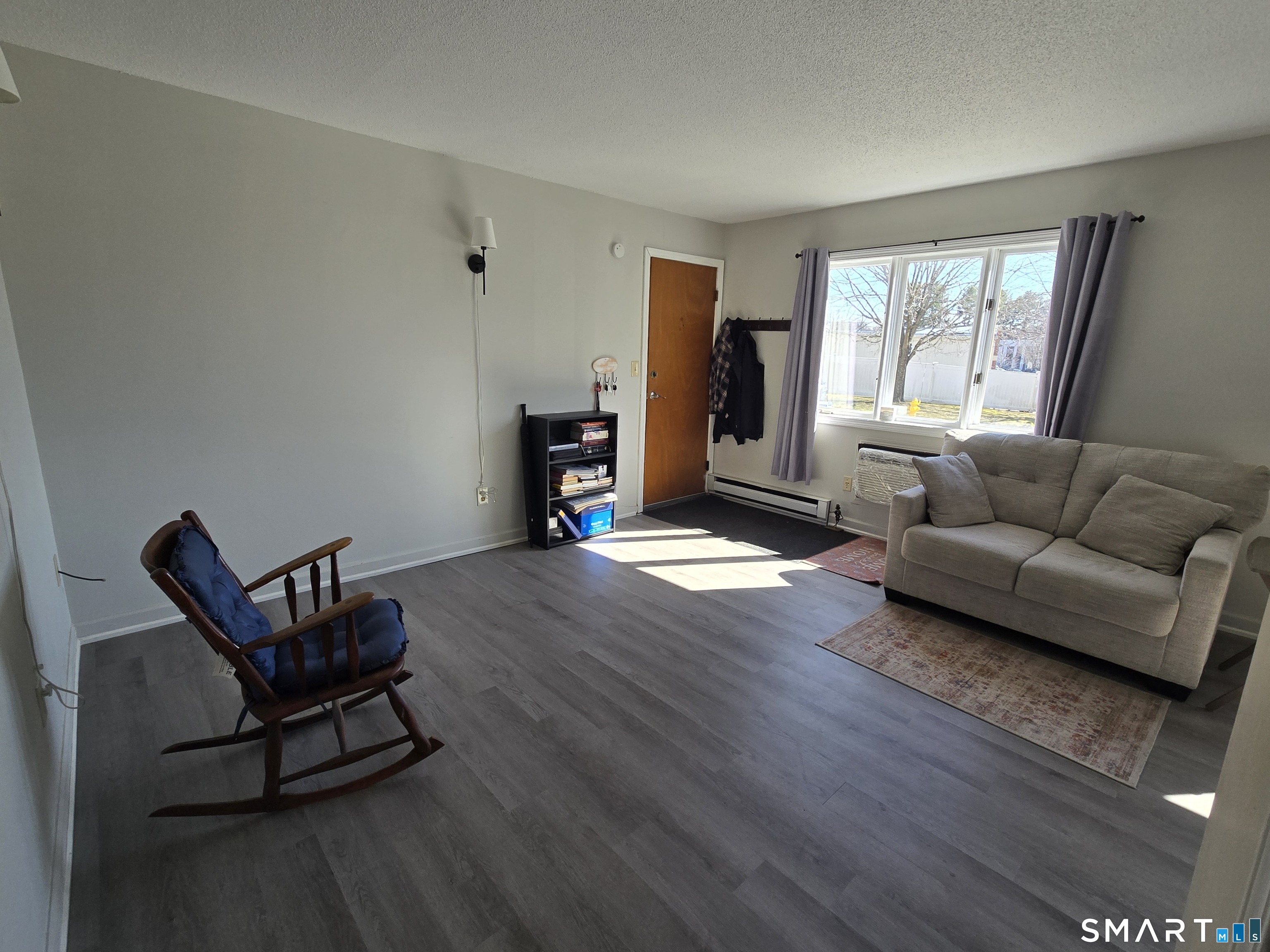 177 Lisle Street, Unit 5 Torrington, CT 06790 - Photo 3 of 18 a living room with furniture and a window
