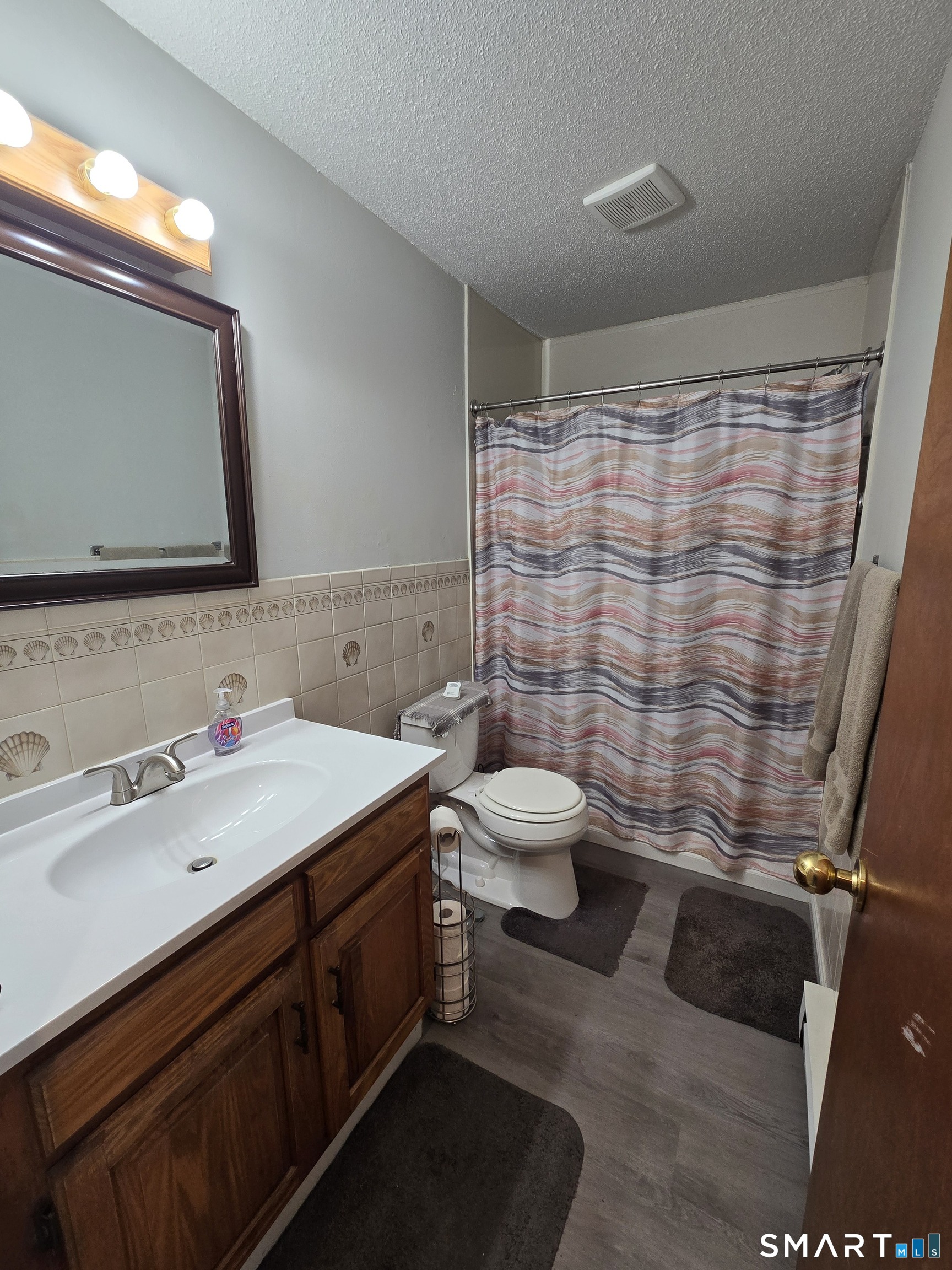 177 Lisle Street, Unit 5 Torrington, CT 06790 - Photo 9 of 18 a bathroom with a sink and a mirror