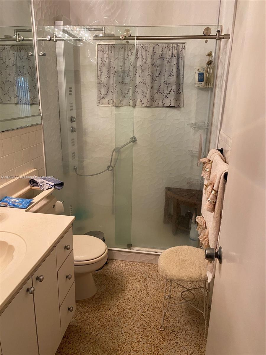 8120 Southwest 10th Terrace Miami, FL 33144 - Photo 11 of 12 a bathroom with a sink a toilet and shower