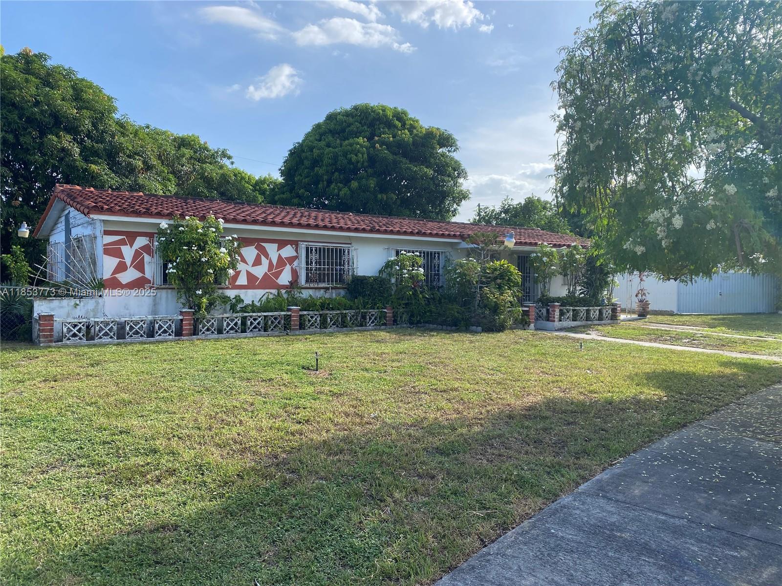 8120 Southwest 10th Terrace Miami, FL 33144 - Photo 2 of 12 a house view with swimming pool and garden space