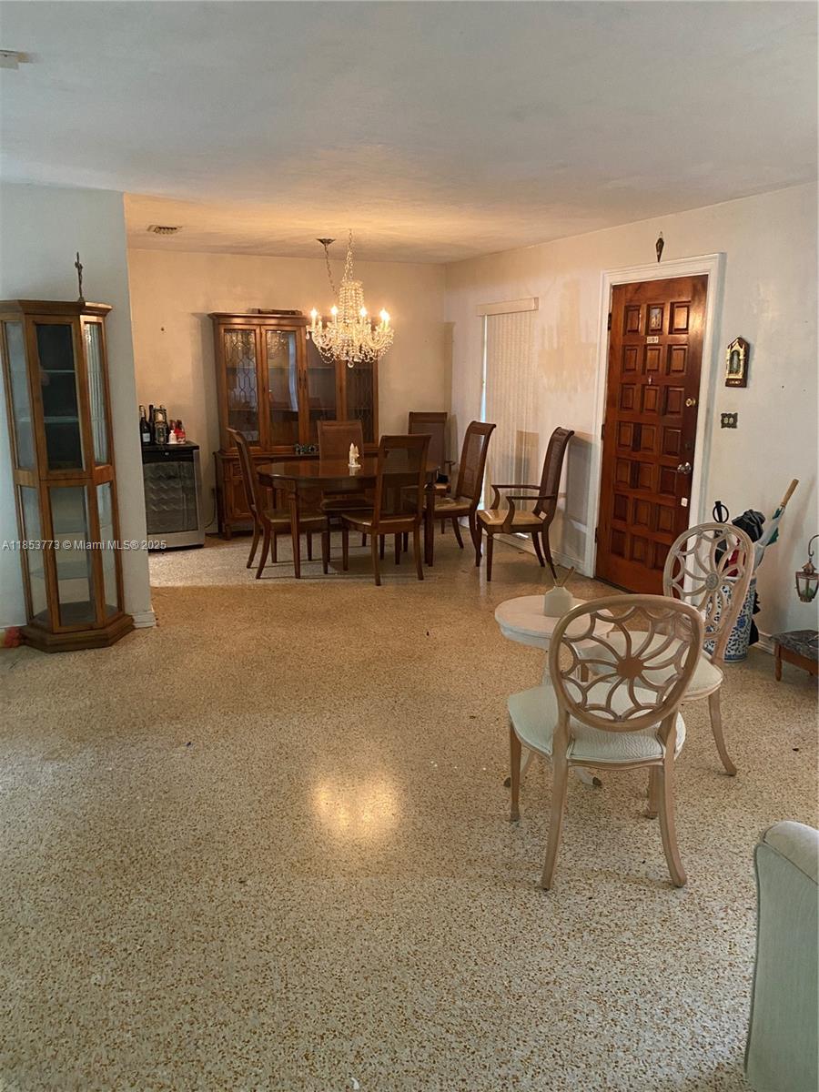 8120 Southwest 10th Terrace Miami, FL 33144 - Photo 6 of 12 a living room with furniture and a table