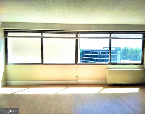 a view of a room with a large window