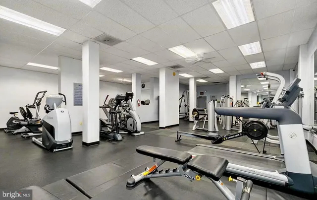a view of a swimming pool with an outdoor seating