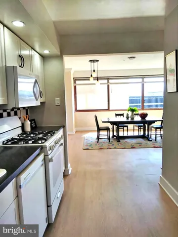 a kitchen with stainless steel appliances granite countertop a stove and a refrigerator