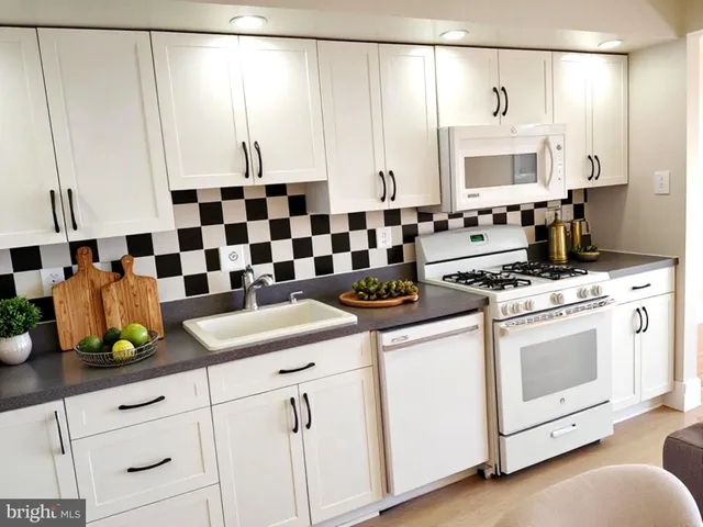 a kitchen with a sink and cabinets