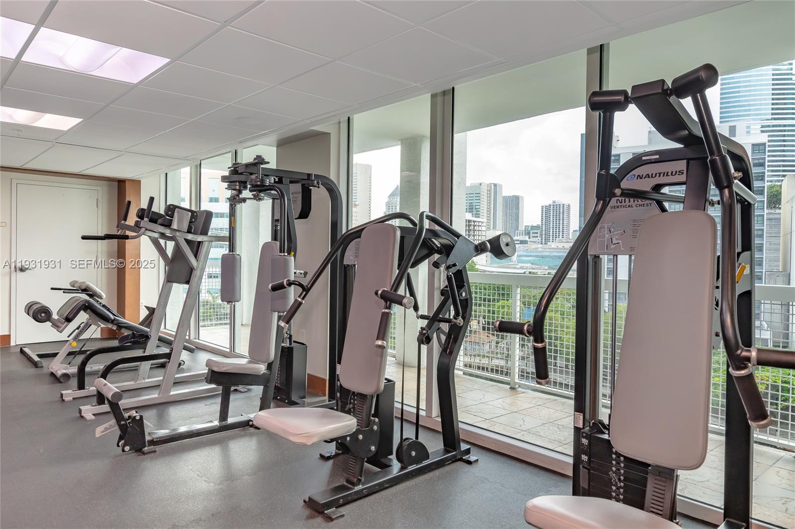 31 Southeast 5th Street, Unit 2907 Miami, FL 33131 - Photo 24 of 38 a view of a room with gym equipment