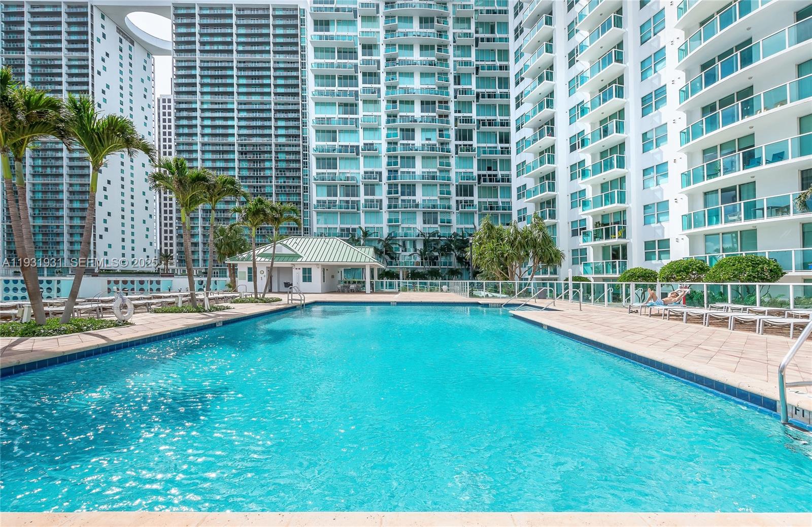 31 Southeast 5th Street, Unit 2907 Miami, FL 33131 - Photo 27 of 38 a view of swimming pool with outdoor seating and plants