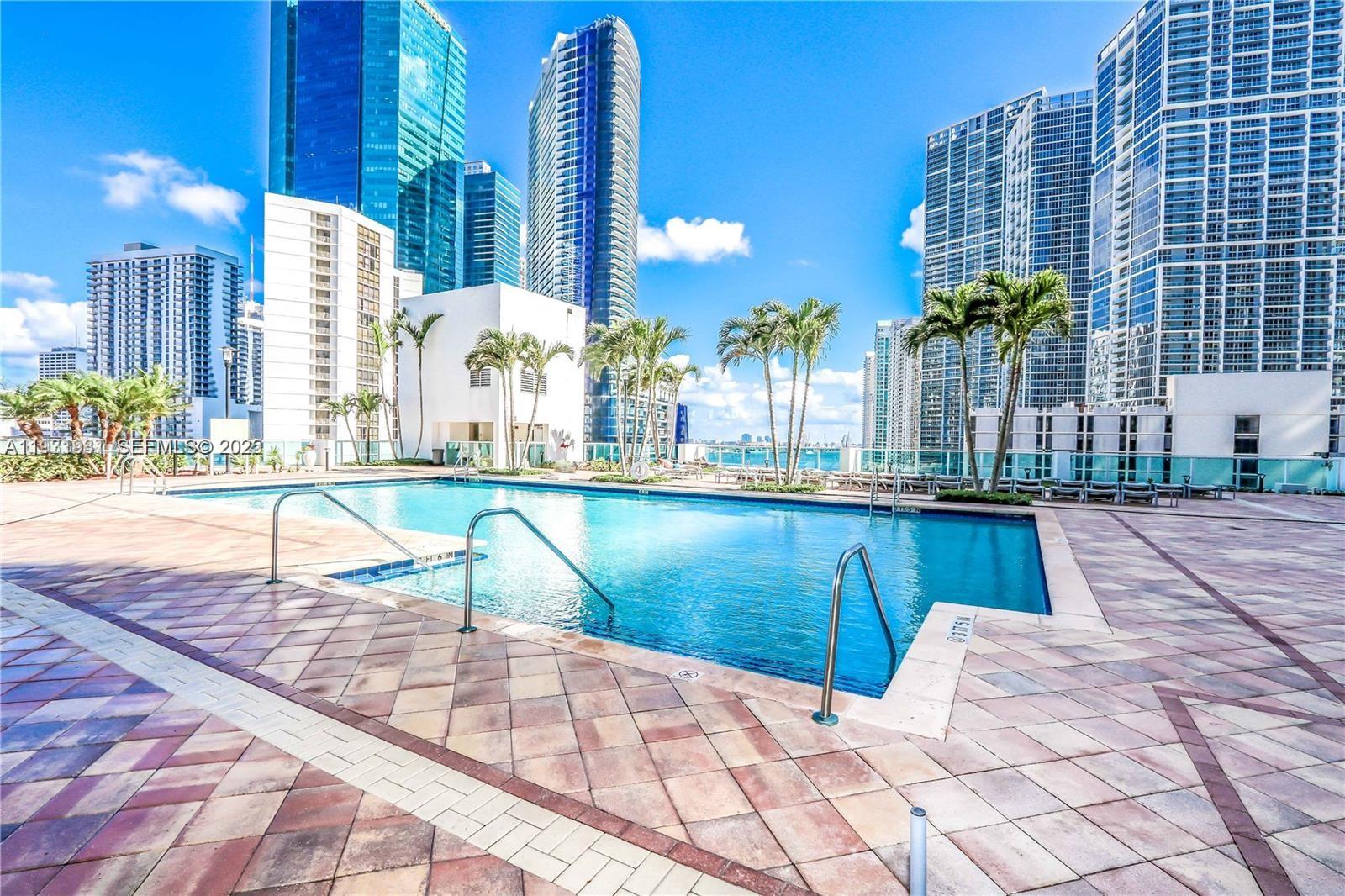 31 Southeast 5th Street, Unit 2907 Miami, FL 33131 - Photo 29 of 38 a view of swimming pool with outdoor seating
