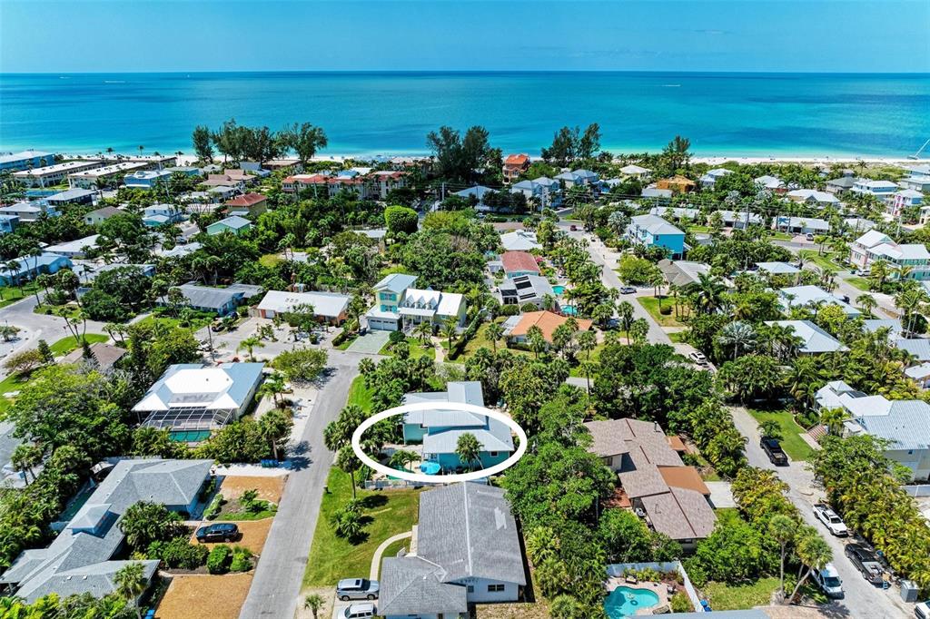 304 74th Street, Unit B Holmes Beach, FL 34217 - Photo 2 of 34 an aerial view of multiple house with outdoor space