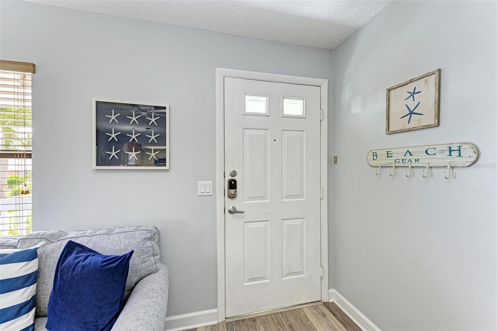 304 74th Street, Unit B Holmes Beach, FL 34217 - Photo 23 of 34 a view of a hallway with windows and closet