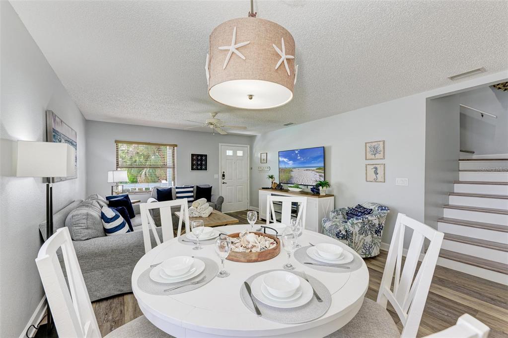 304 74th Street, Unit B Holmes Beach, FL 34217 - Photo 7 of 34 a view of a dining room with furniture