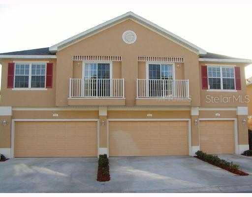 27622 Pleasure Ride Loop Wesley Chapel, FL 33544 - Photo 1 of 1 front view of a house with a white building