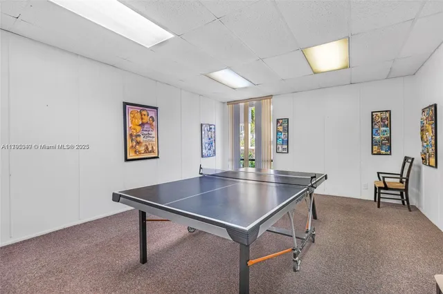 a room with furniture pool table and table soccer