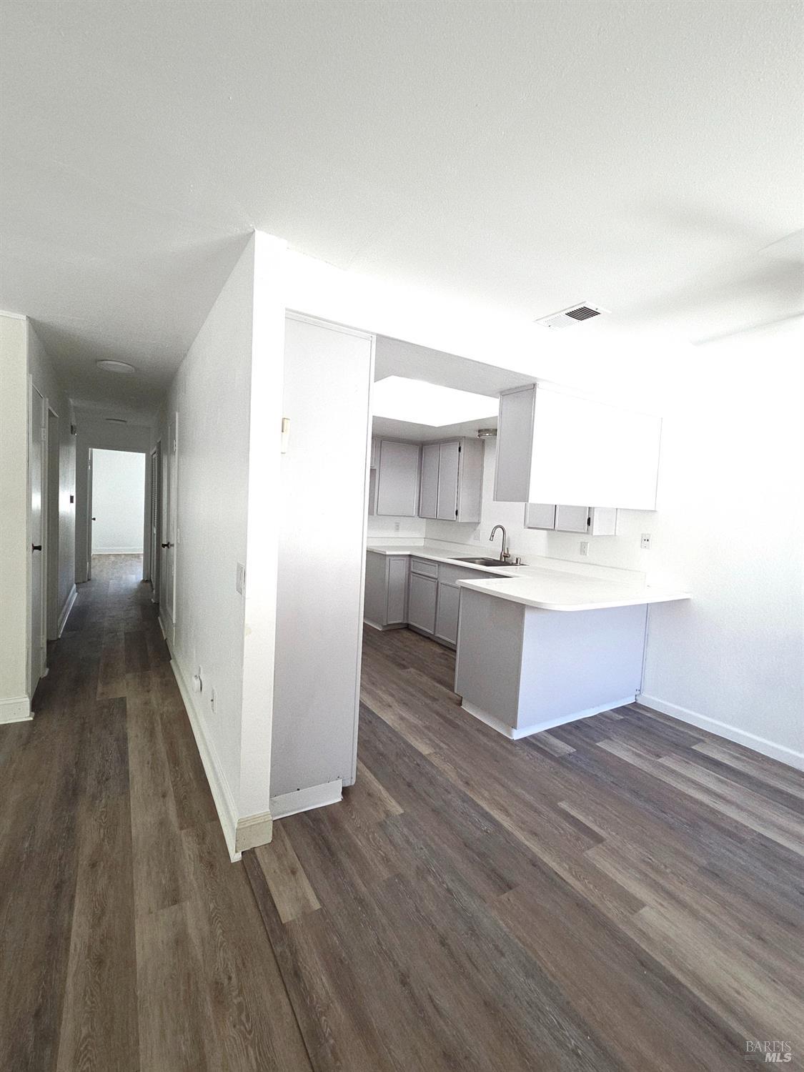 140 Del Rio Court, Unit 4 Vacaville, CA 95687 - Photo 10 of 25 a spacious bathroom with a sink mirror and vanity