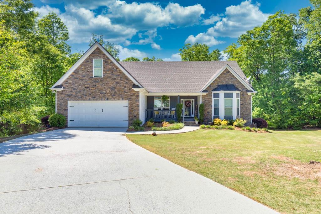 2660 Sleepy Hollow Road Monroe, GA 30655 - Photo 1 of 1 a front view of house with yard outdoor seating and barbeque oven