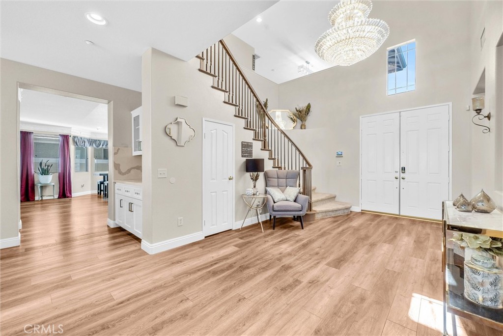 11499 Bridgeway Drive Riverside, CA 92505 - Photo 4 of 70 a view of a livingroom with wooden floor and stairs