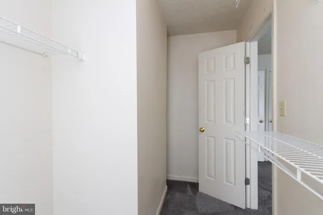 a view of a hallway with closet