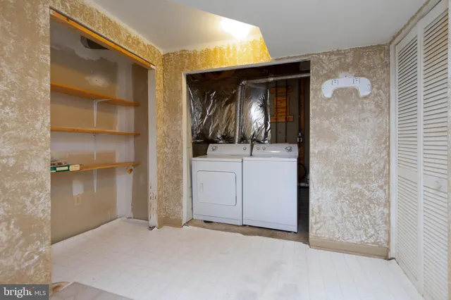 a view of an empty room with stairs