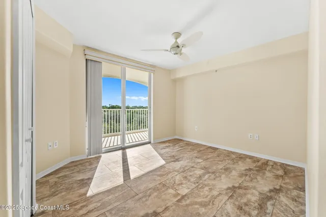 a view of a balcony with wooden floor
