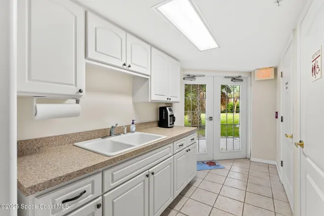 a living room with fireplace furniture and a large window