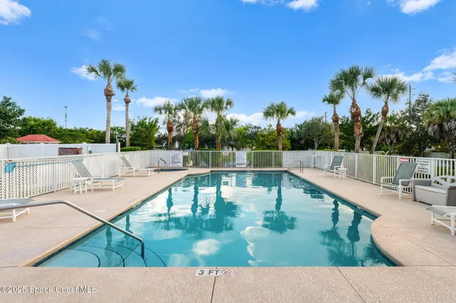 a view of a garden with palm trees