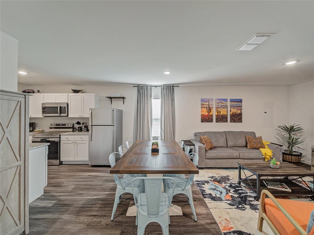 921 West 9th Street Bonham, TX 75418 - Photo 5 of 24 a living room with stainless steel appliances furniture and a kitchen view