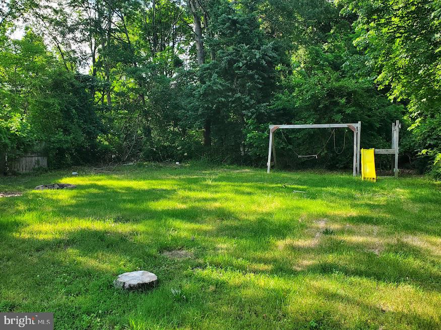 110 Lemmon Avenue Pemberton, NJ 08068 - Photo 15 of 15 a backyard of a house with trampoline