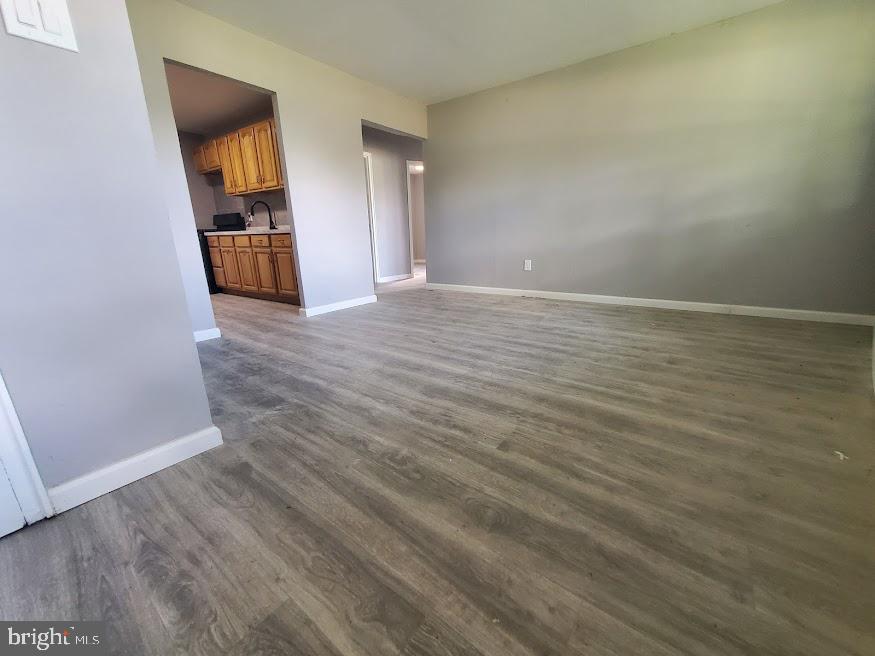110 Lemmon Avenue Pemberton, NJ 08068 - Photo 5 of 15 a view of a room with wooden floor and brick wall