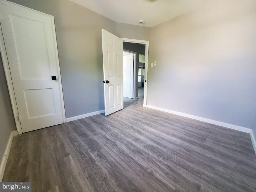 110 Lemmon Avenue Pemberton, NJ 08068 - Photo 9 of 15 a view of an empty room with wooden floor and a window
