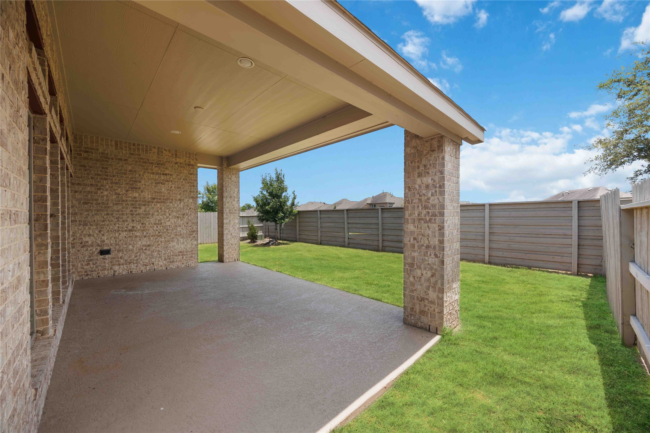 4333 Arbor Crest Lane Manvel, TX 77578 - Photo 26 of 40 The spacious covered patio serves as an exceptional open-air lounge, offering a shaded vantage point with plenty of room for custom outdoor dining or seating arrangements.