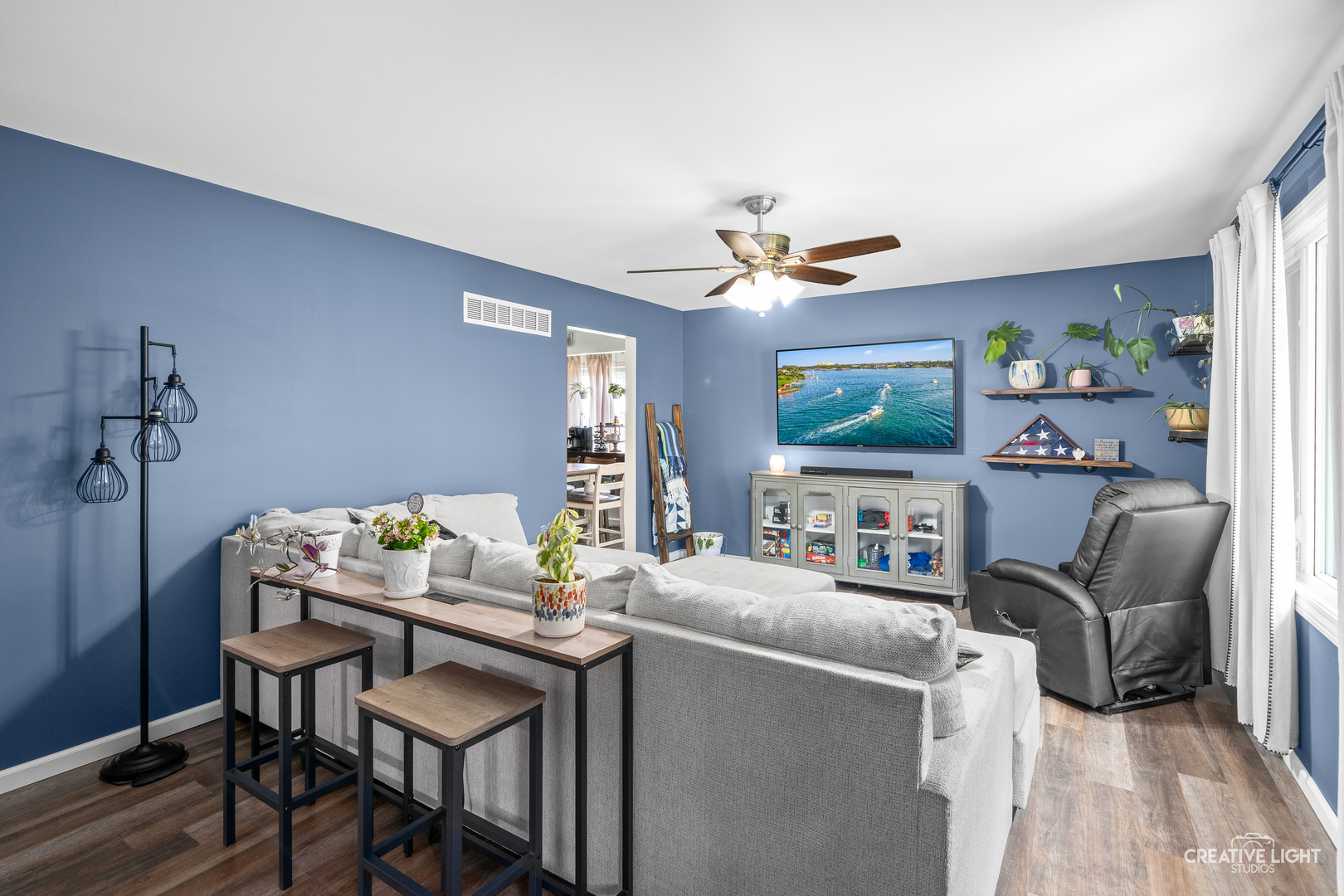 3000 Art Schultz Drive Plainfield, IL 60586 - Photo 4 of 18 a work room with furniture and a flat screen tv