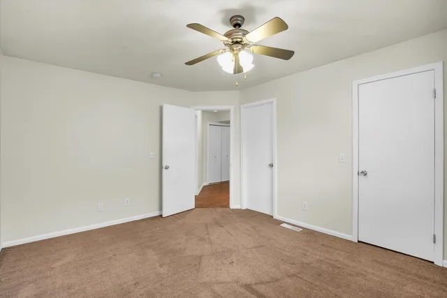 a view of a big room with carpet