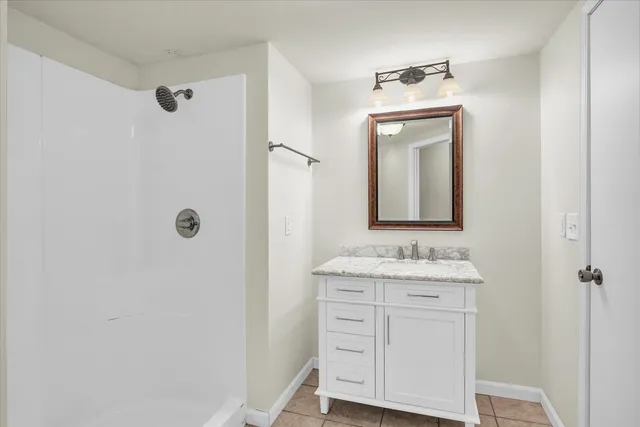a bathroom with a sink a vanity and a mirror