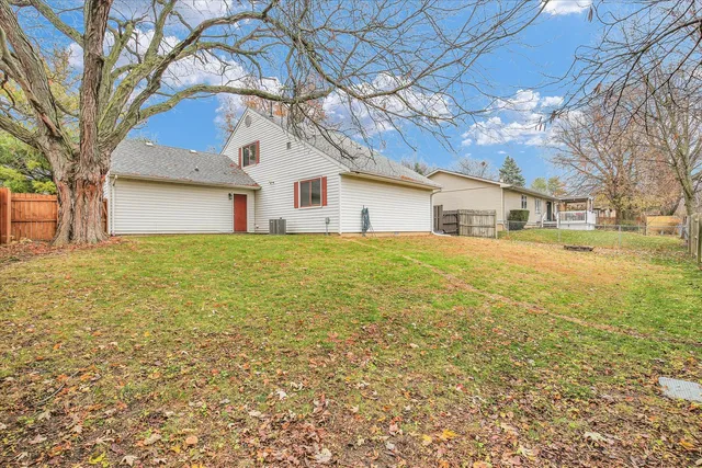 a house that has a tree in front of it
