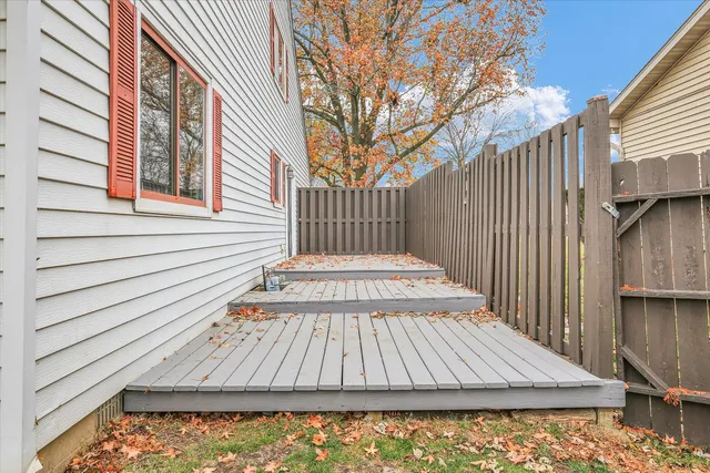 a view of outdoor space with deck and kitchen