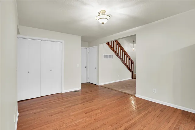 a view of an entryway with wooden floor