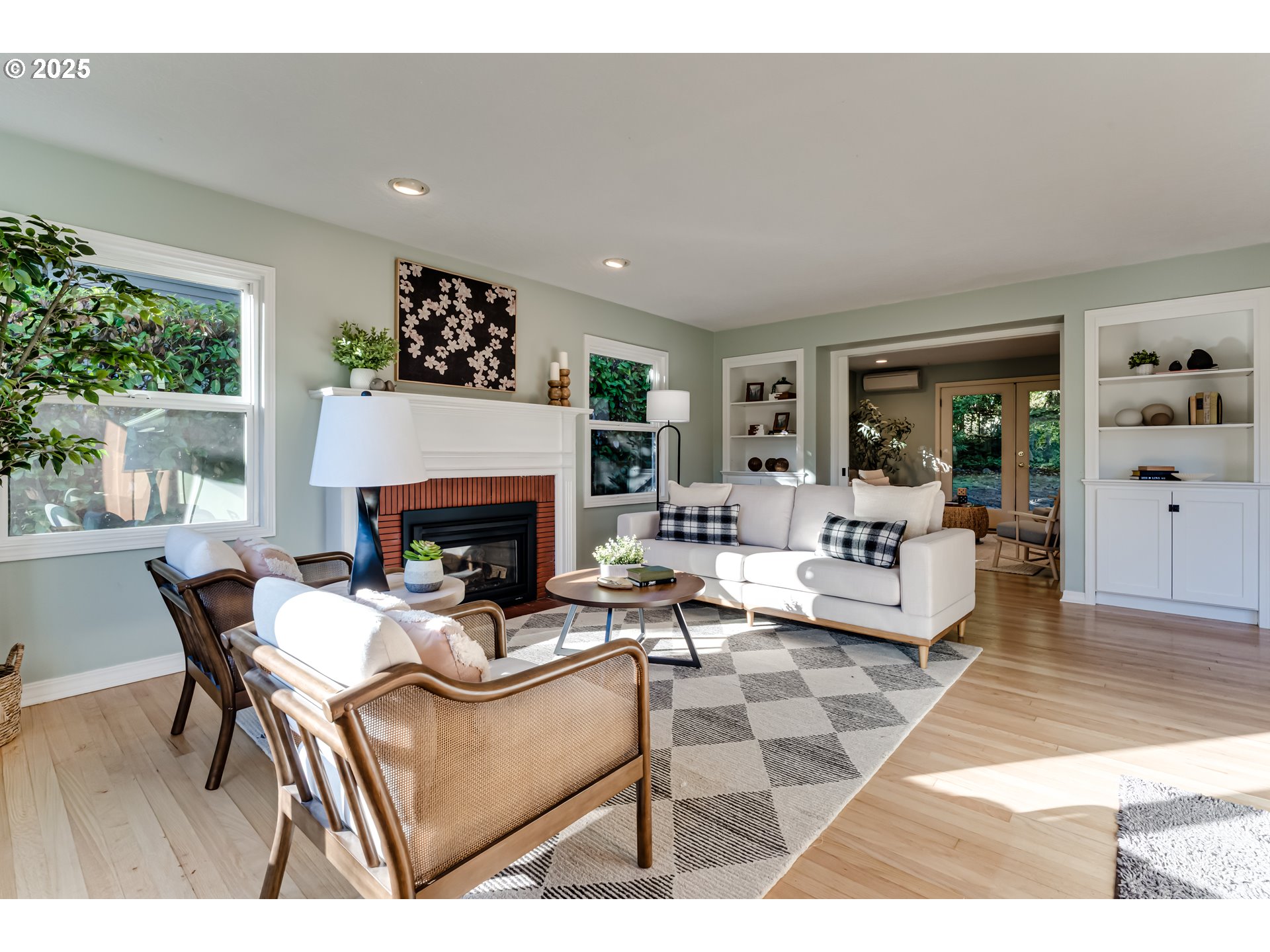 2140 Monroe Street Eugene, OR 97405 - Photo 14 of 35 a living room with furniture a fireplace and a large window