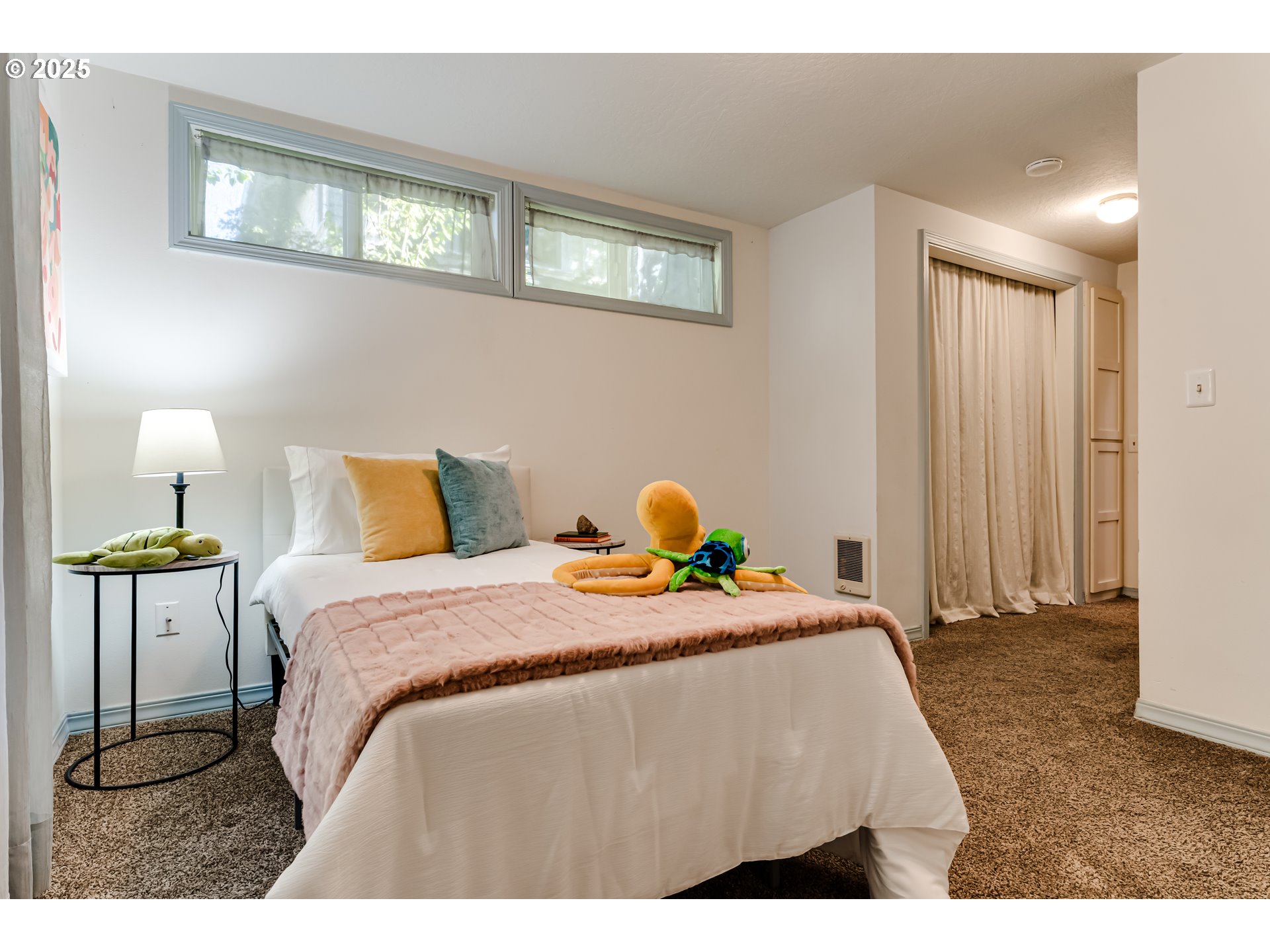 2140 Monroe Street Eugene, OR 97405 - Photo 22 of 35 a bedroom with a bed and wooden floor